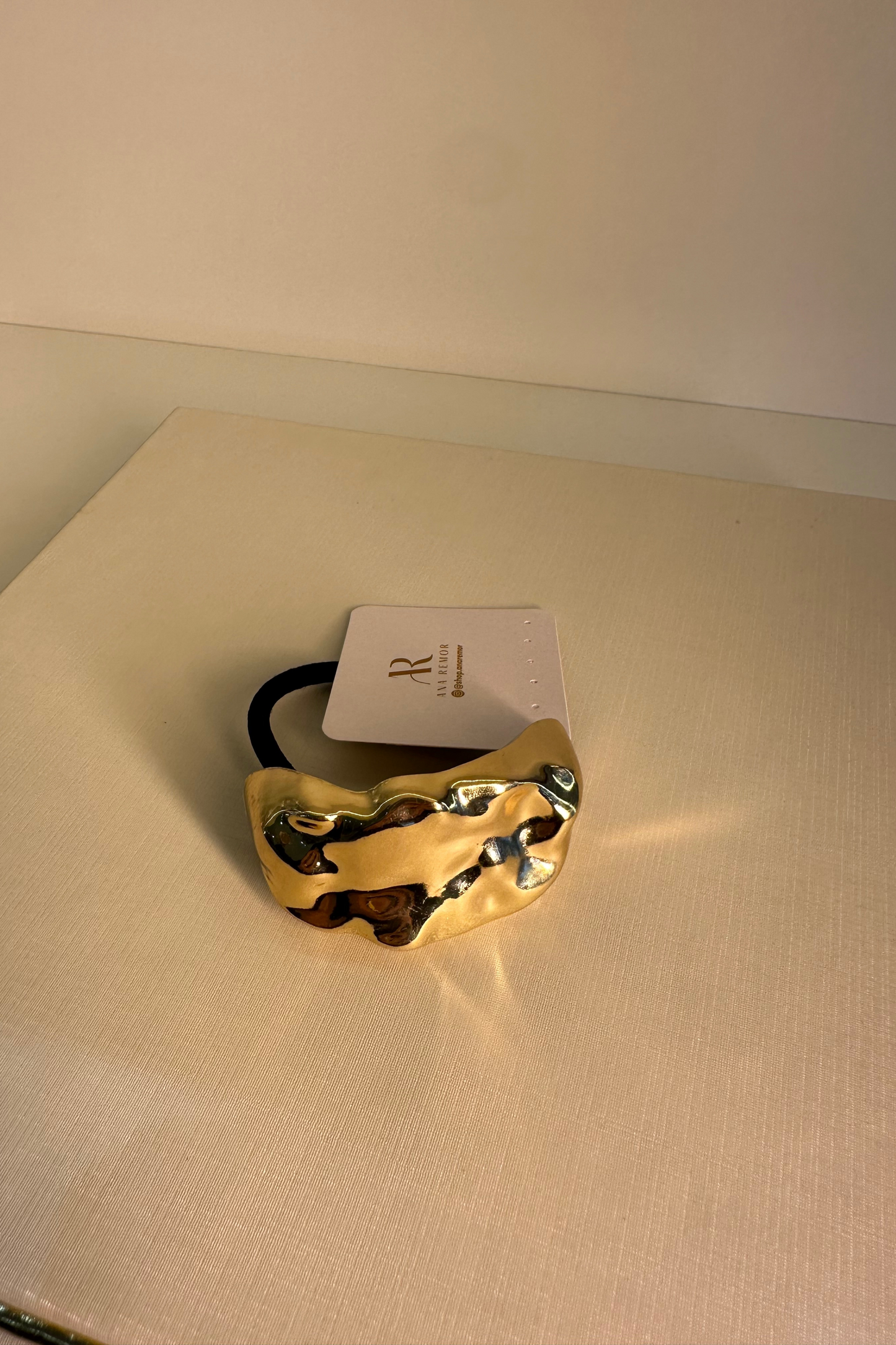 AMARRADOR DE CABELO DOURADO