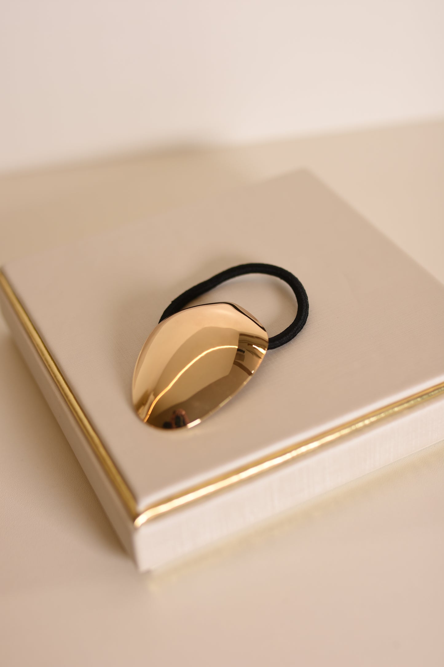 ELASTICO DE CABELO OVAL DOURADO